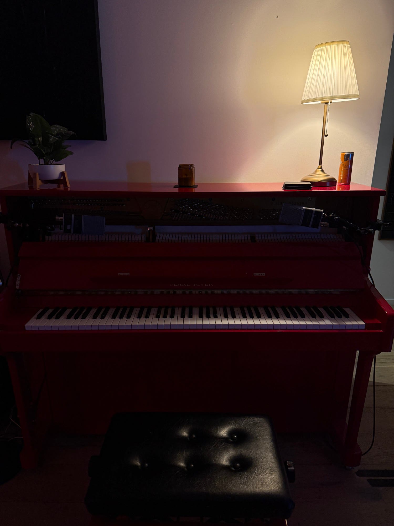 red upright piano, mics in