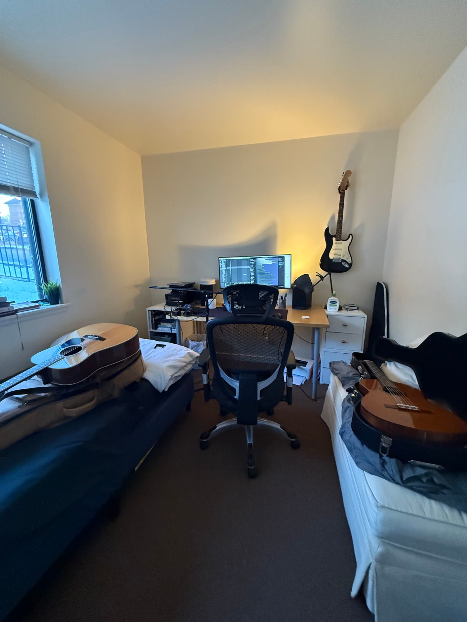 bedroom studio with guitars
