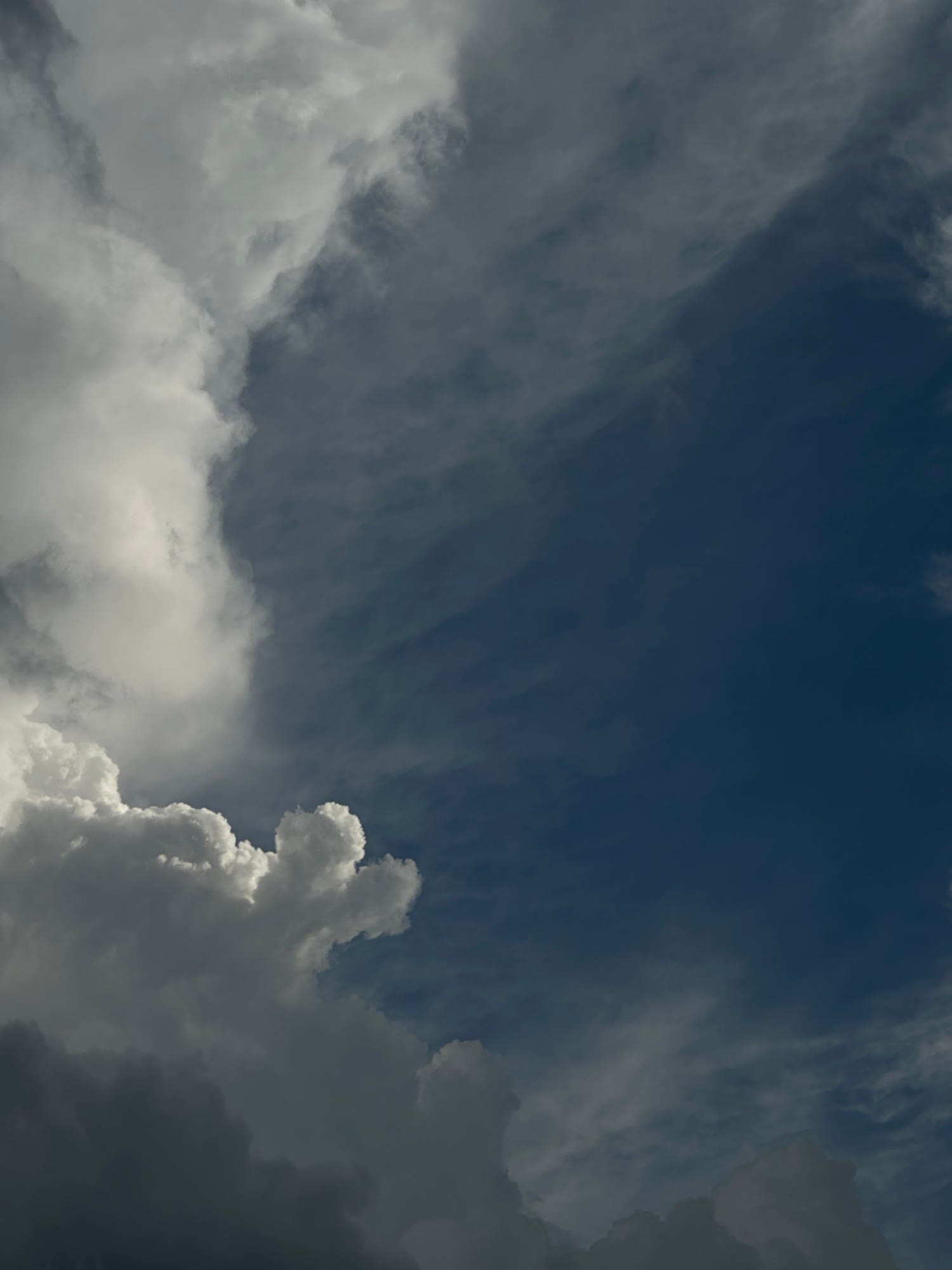 storm clouds against a dark blue sky
